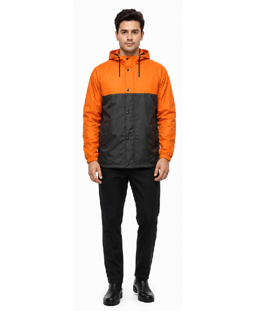 Man wearing an orange and black jacket on a white background