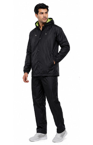 Person wearing a black raincoat with a logo on a white background