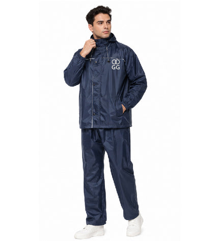 Man wearing a navy raincoat and pants with a logo on a white background