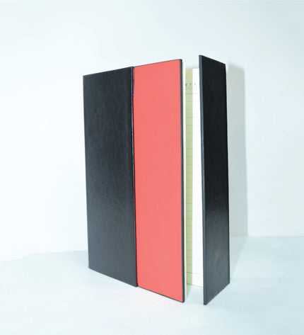 Book with black cover and pink interior on a white background