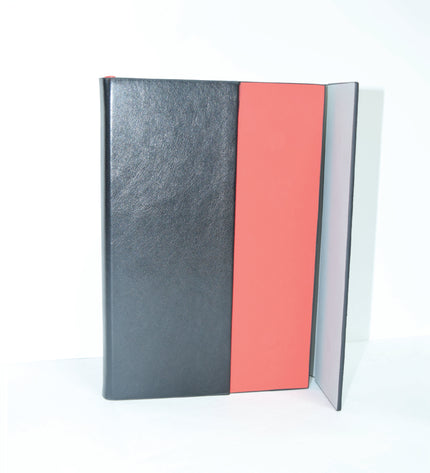Notebook with black and pink design on a white background