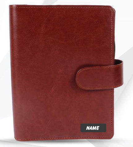 Red leather planner with a strap on a white background