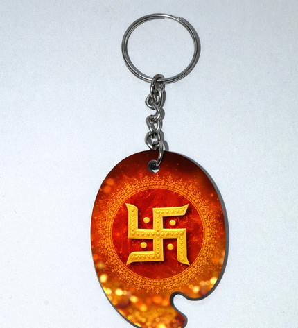 Keychain with a swastika symbol on an orange background