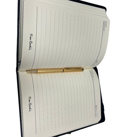 Open notebook with a pen on a white background