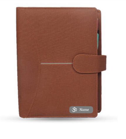 Brown leather-bound notebook with a name tag on a white background