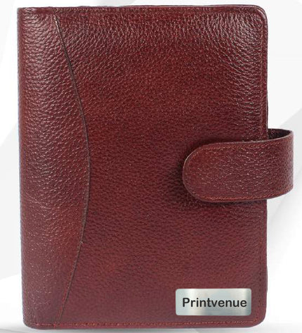 Brown leather notebook with a strap closure on a white background, featuring the Printvenue brand.