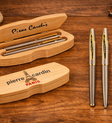 Pierre Cardin pens with wooden case on a wooden surface