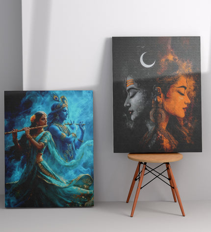 Two artistic paintings on a gray wall with a wooden stool between them.