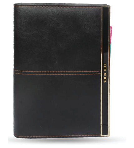 Black leather notebook with gold stitching on a white background