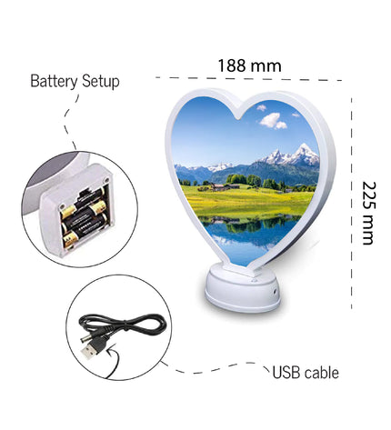 Heart-shaped LED lamp with battery setup, USB cable, and scenic display on a white background